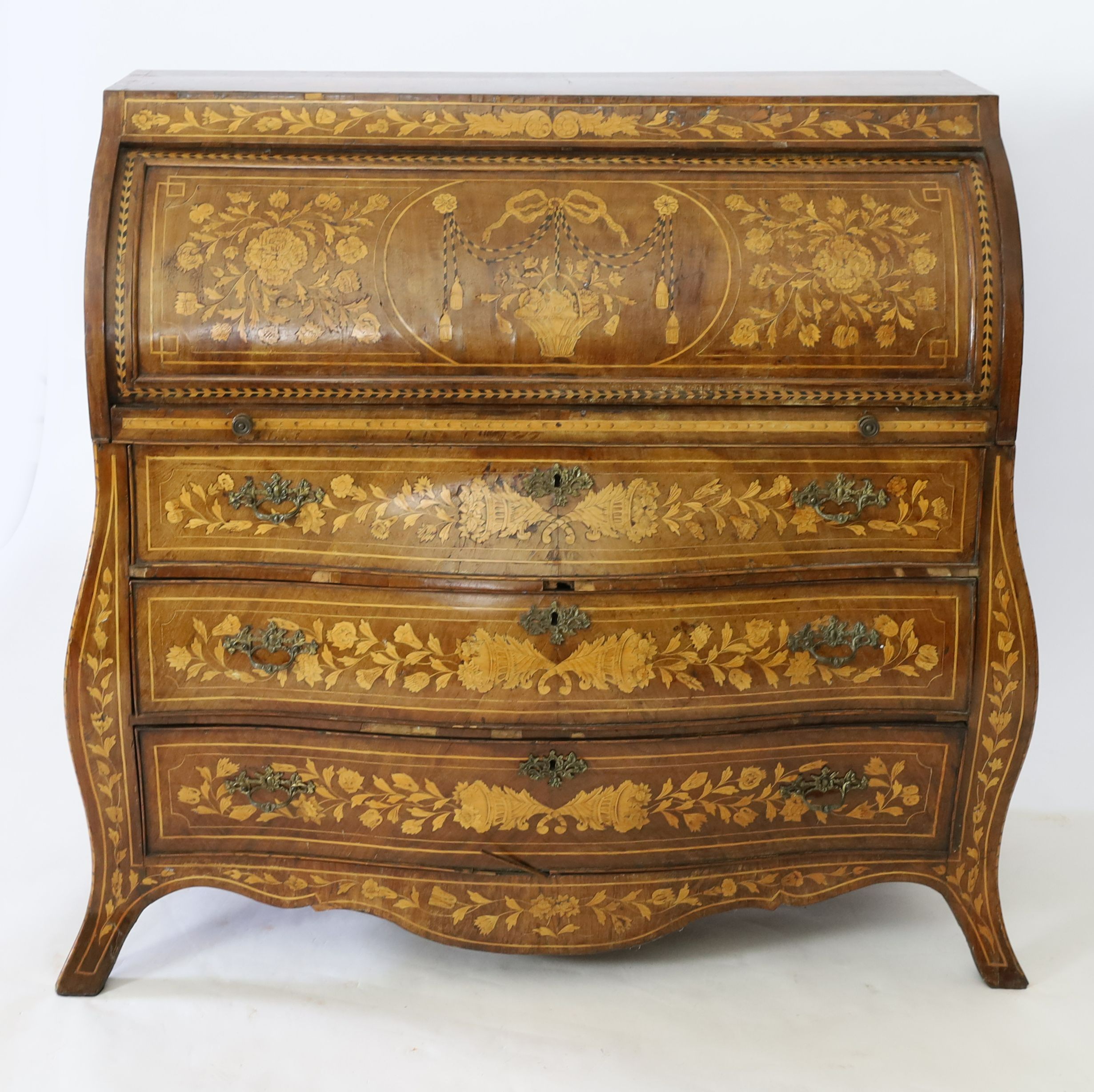 An early 19th century Dutch walnut and floral marquetry bombe cylinder bureau, W.133cm D.58cm H.122cm